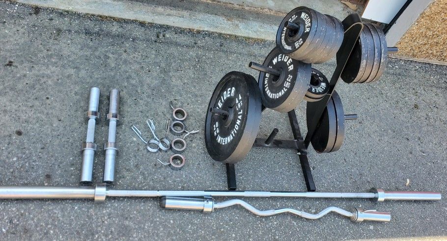 325 pounds of olympic weights, bars and plate tree!