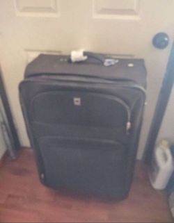 Very nice travel luggage with wheels Delsey brand