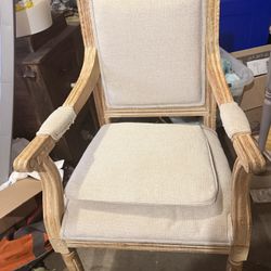 Elegant wooden armchair with beige cushions. 42"x 24" Solid wood chair