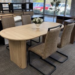 5-Piece Dining Set, A warm, modern dining set that comfortably seats 4–6 people. The 63” natural wood-grain table pairs beautifully with fo