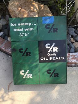 C/R Quality safety oil seals shop hanging metal display case. Vintage