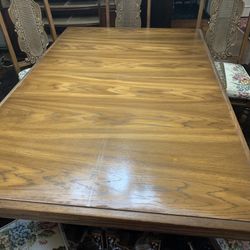 Table 6 chairs  ALL WOOD.    GREAT Condition. Comes with 1 leafs and Table Pads for entire table  too   About 41 inches wide 66 long 