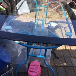 A Nice Glass Patio Table With , Blue  Bottom (60 “Long X  41” Wide X 28” Tall )