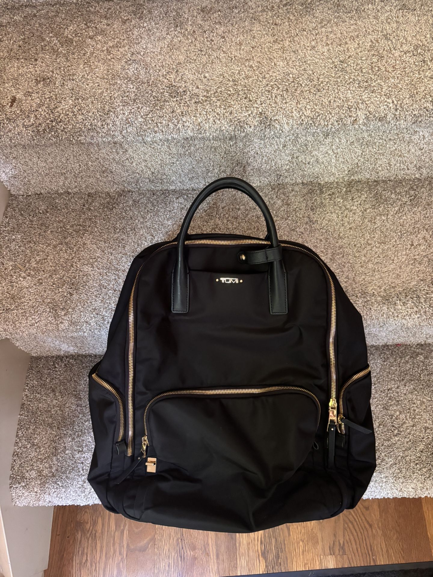 Tumi Black Backpack With Gold Accents 