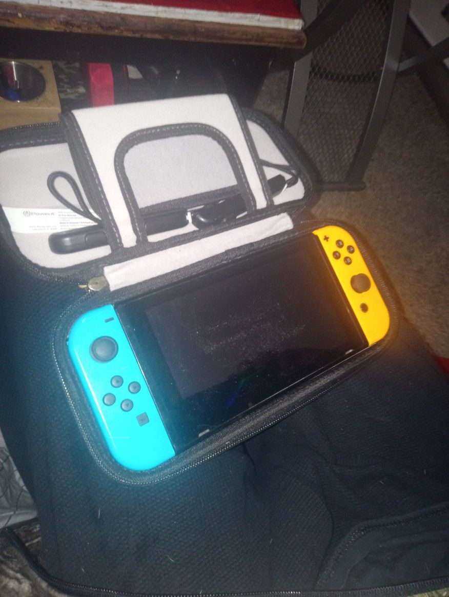 Nintendo switch with Zelda case and games