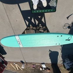 Teal soft top surf board