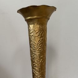 Tall metal vase with decorative pattern all over. Stylish and eye-catching piece, perfect for adding character to any space.