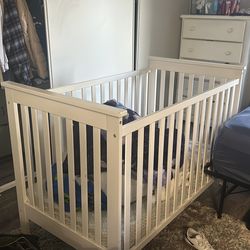 White crib with mattress