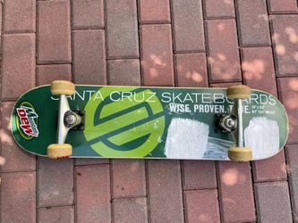 Green Santa Cruz Mountain Dew skateboard