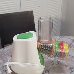 Electric vegetable grater