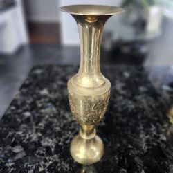 This is a vintage, etched brass vase