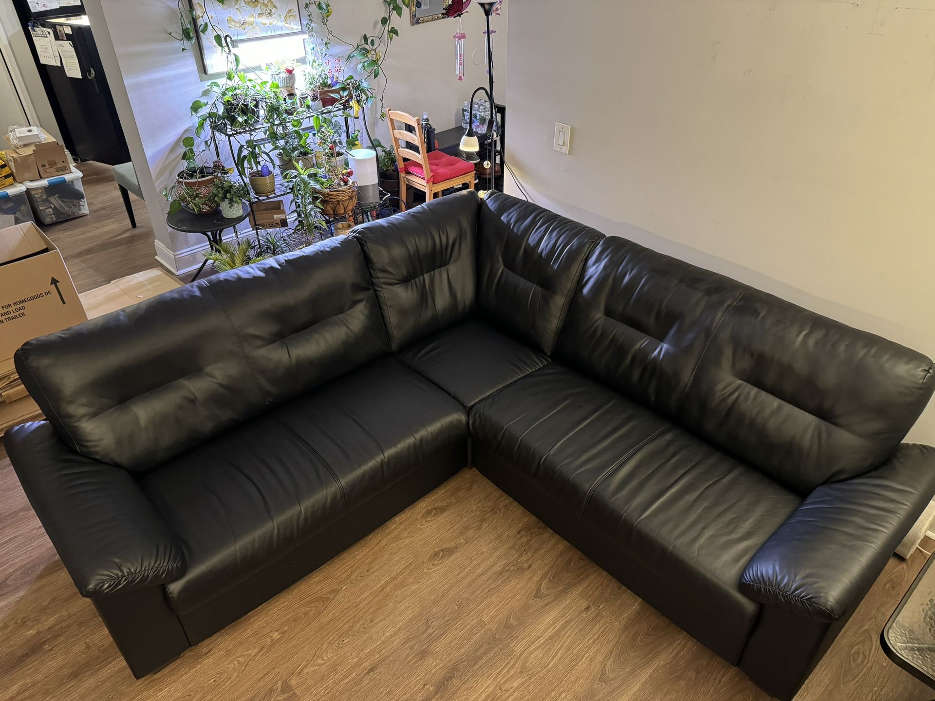 IKEA sectional couch (black leather) + IKEA Coffee table (black)