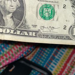 One dollar bill with 2013