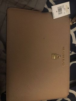 Blush colored wristlet Michael Kors