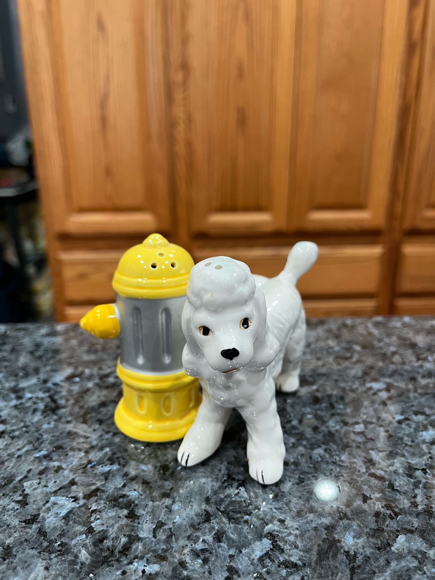 Ceramic Vintage Dog and Yellow Fire Hydrant Pair of Salt and Pepper Shakers. Preowned no cracks or chips.