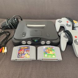 Nintendo 64  (W/ Cords) + Super Mario 64 + Super Smash Bros. + 2 Controllers 