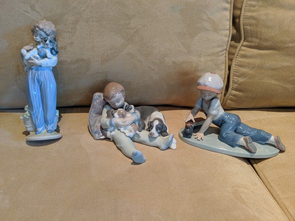 Set of three Lladro figurines: Sweet Dreams, All Aboard and My Buddy