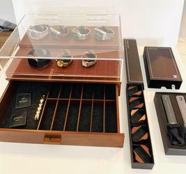 Sleek wooden watch display with clear acrylic top