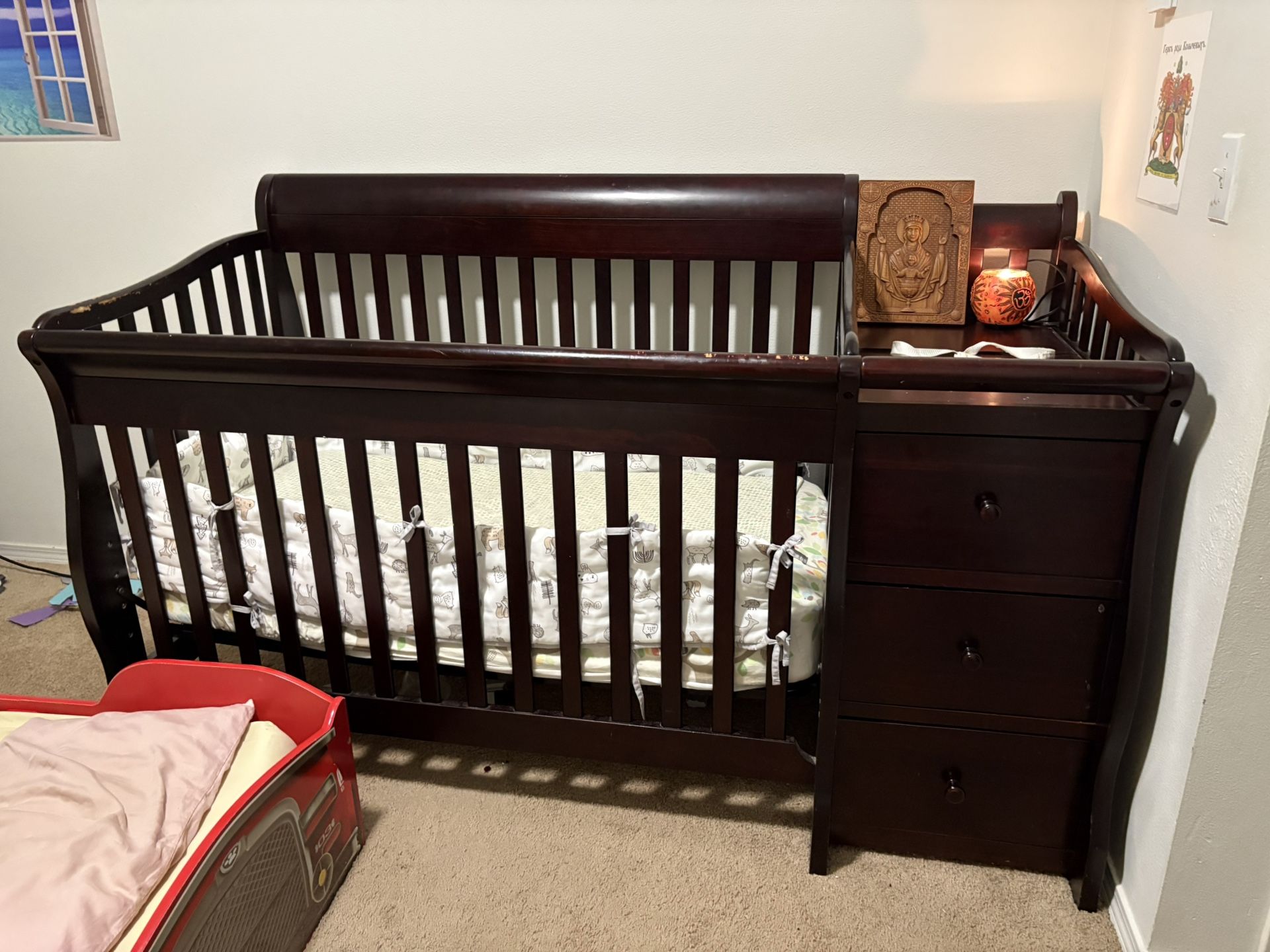 Baby crib with side changing table
