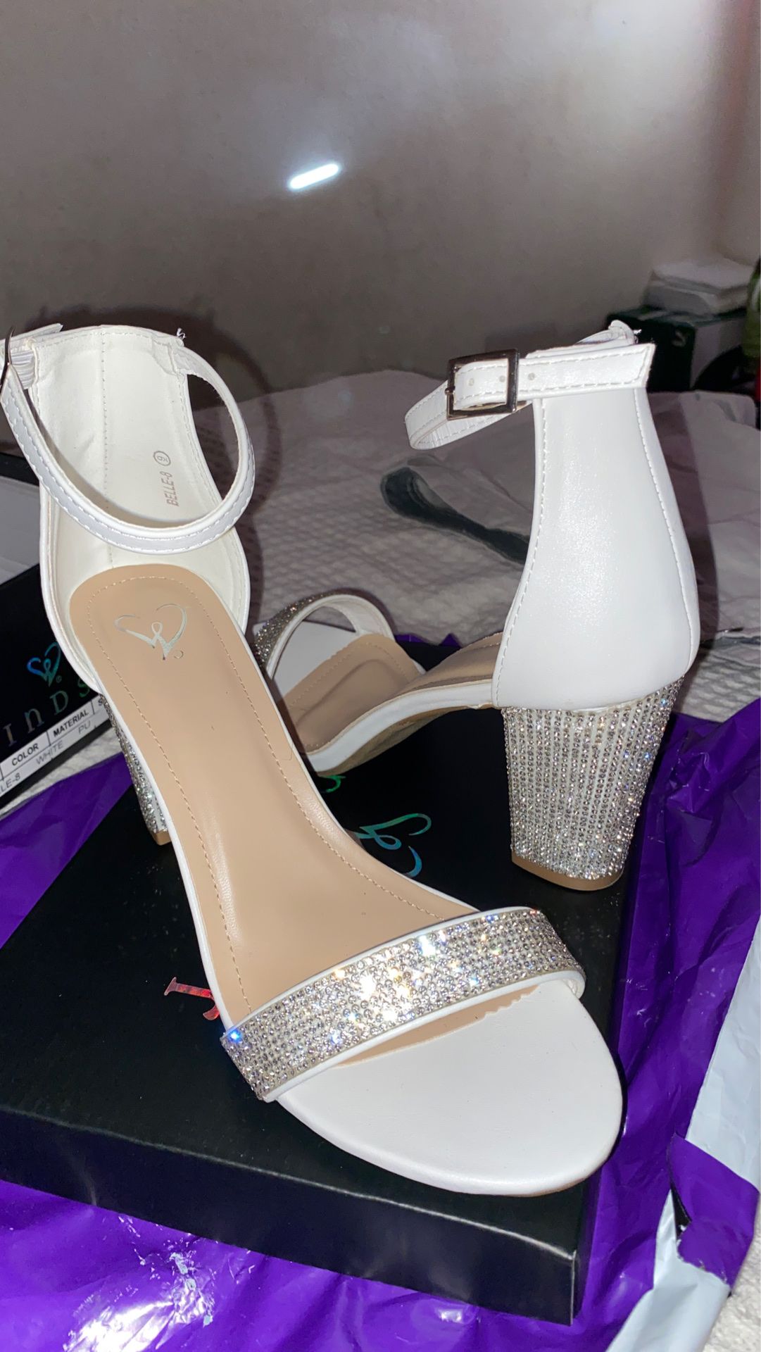 White heels for sale. Size 9 never used heel to high for me. Selling for $25 let me know if your interested.