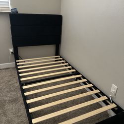 Black twin size bed frame.