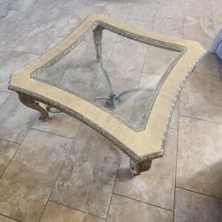 Center table solid wood with thick glass cover.