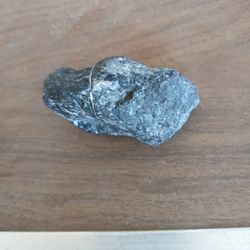 ONE BLACK AND WHITE ROCK, ONE  THATS BROWN AND WHIT  KINDA, A BLUE AND WHITE ROCK, Dark Blue Rock, And ALSO A PIKE OF BLACK ONES AS WELL,