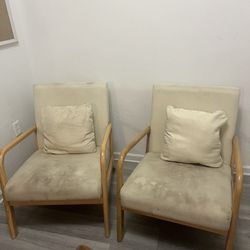 Two Wooden Chairs with Pillows
