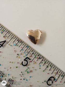 A tiny gold sweetheart locket