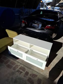 Tv stand and bookshelf.