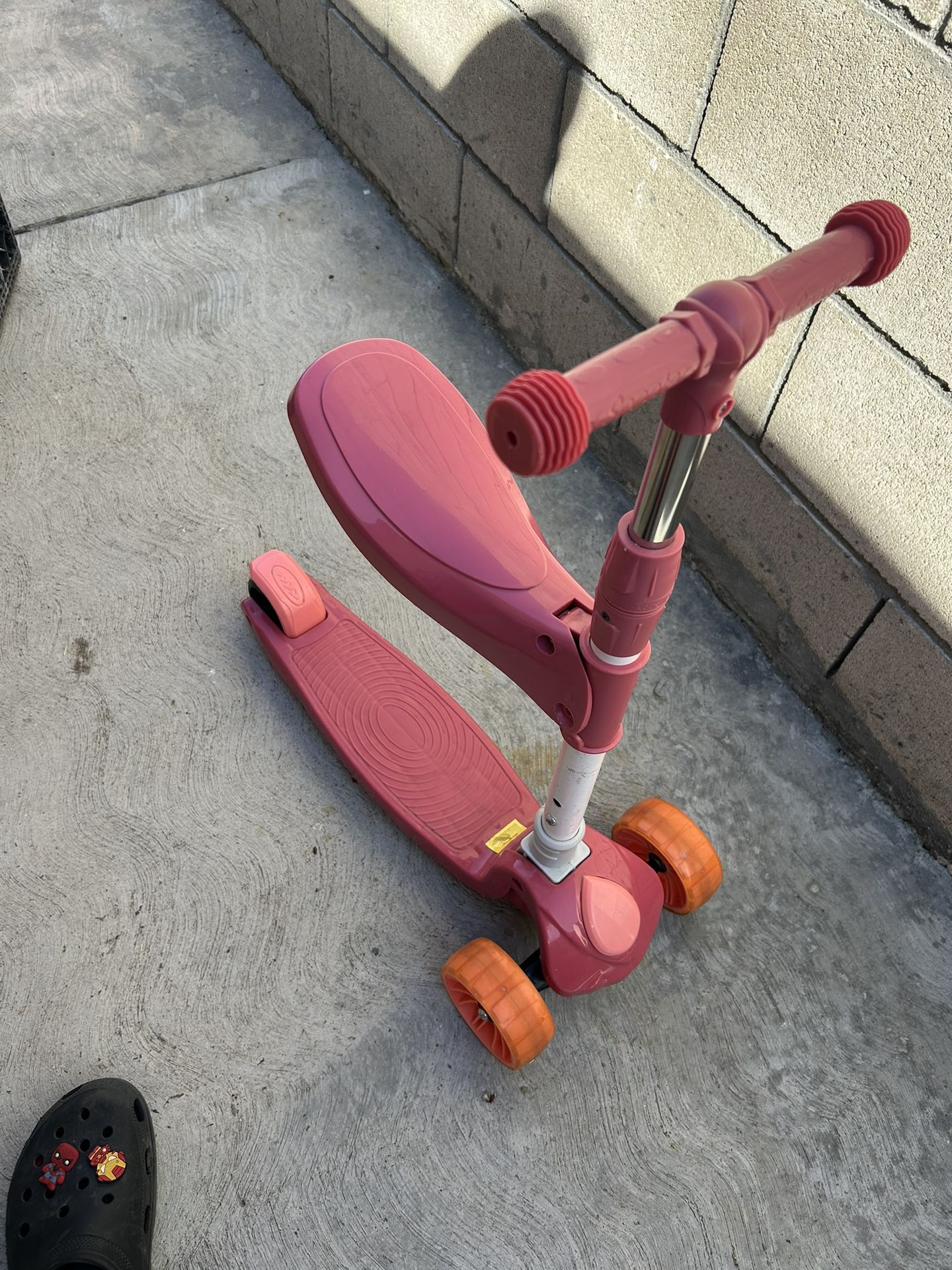 three-wheeled kick scooter
