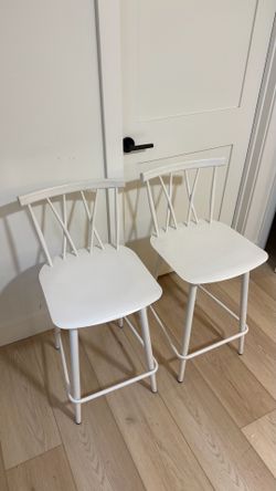 Two white tall barstools