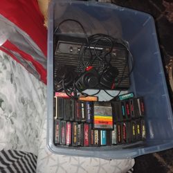 Atari With 27 Games Paddlers And Controllers