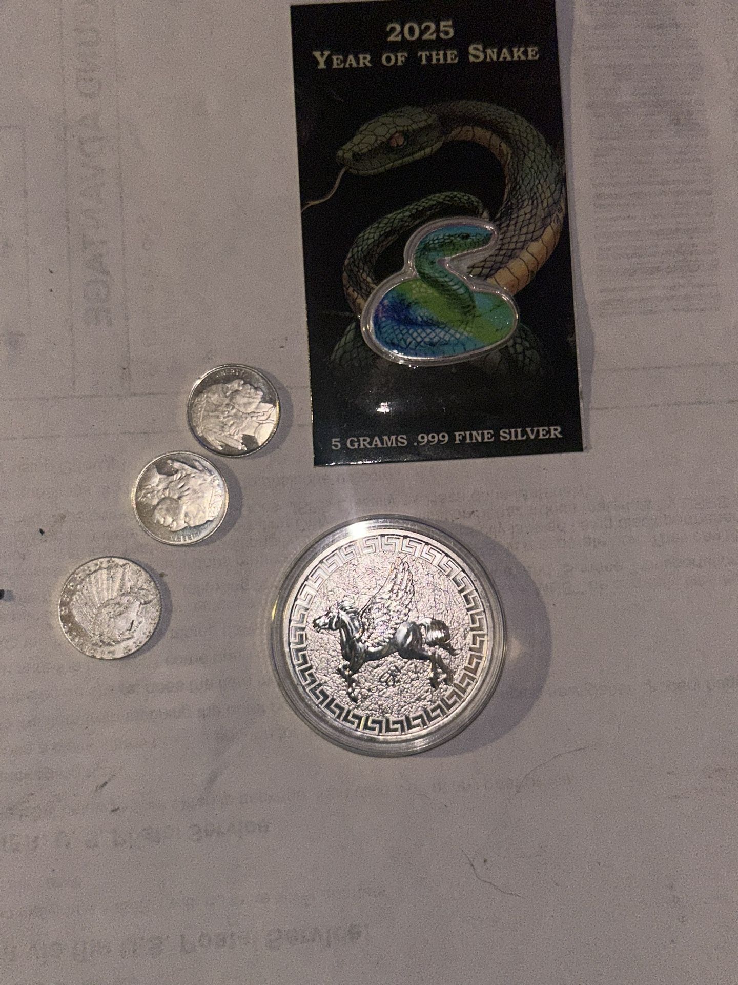 small Silver Light A Premium 1/4 Ounce Indian Buffalo With A 1 Ounce Pegasus And A Five Grand Colorized Snake