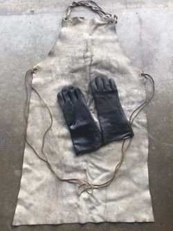 Used welders apron and gloves