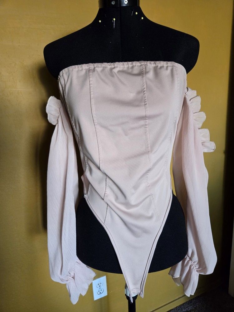 beige off-the-shoulder bodysuit with sheer ruffled sleeves
