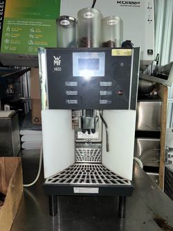 Cappuccino espresso and hot chocolate machine with three different coffee flavors