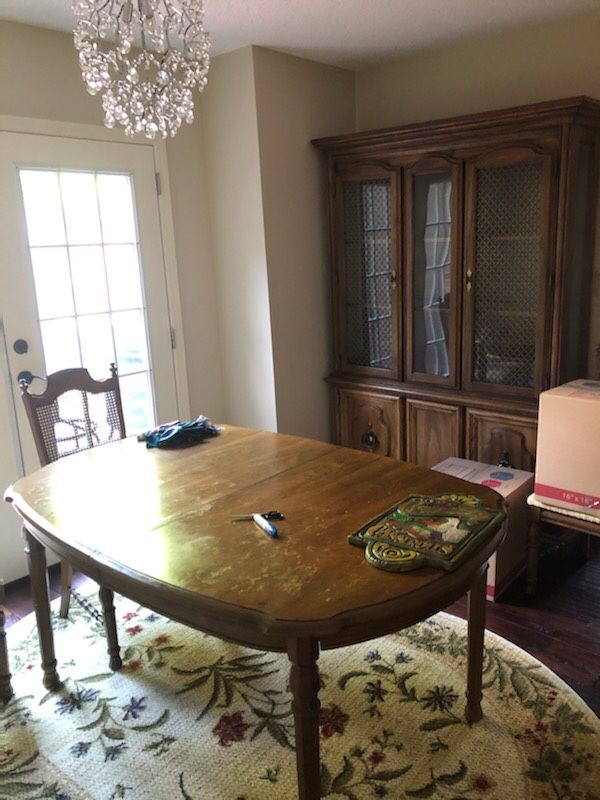 Dining table, 6 chairs, extra leaf for table, china cabinet.