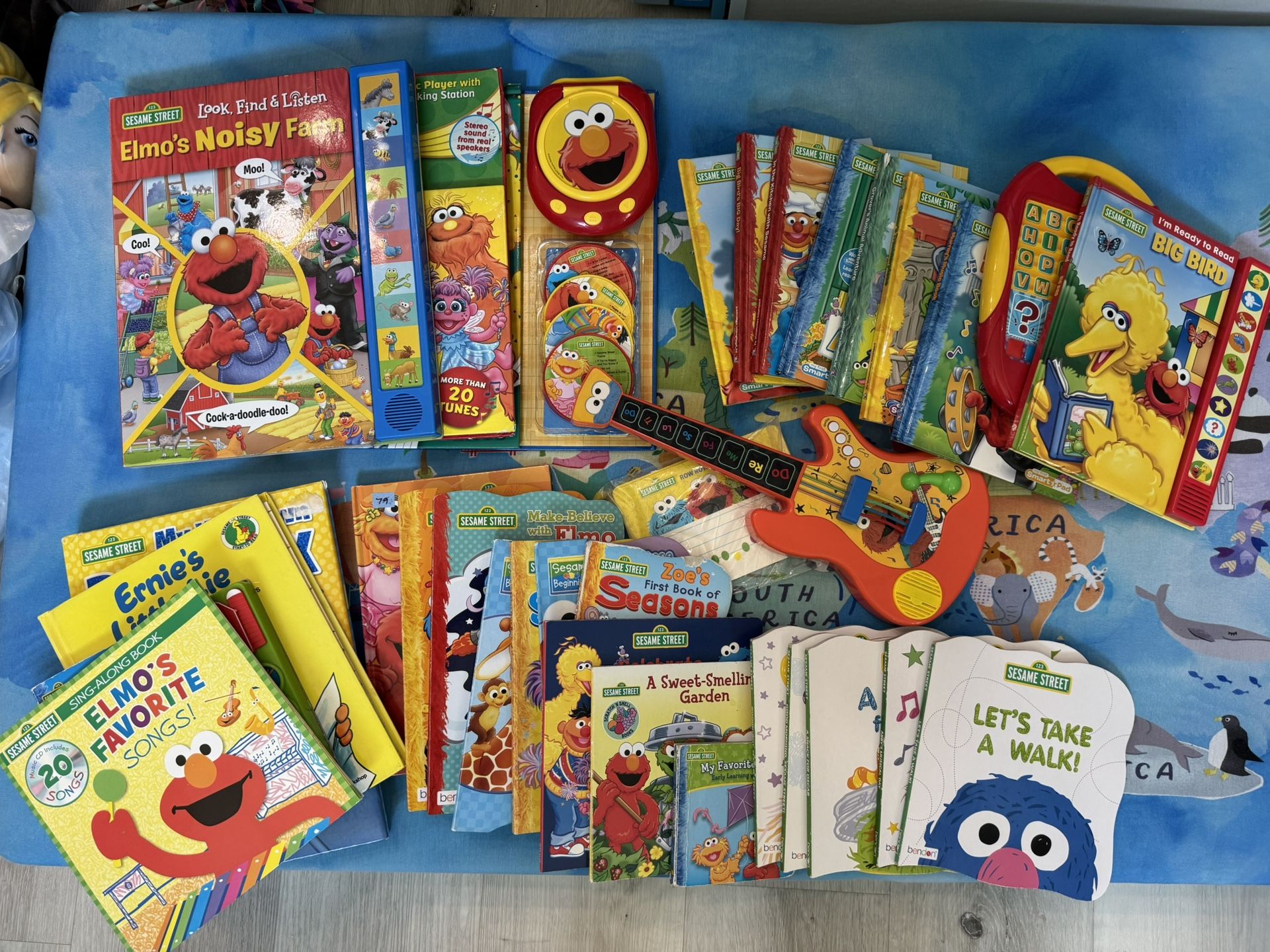 Various Sesame Street Books And Dolls