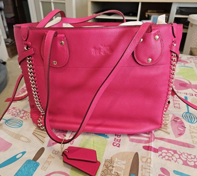 Brand new, never used pink leather Coach Tote.