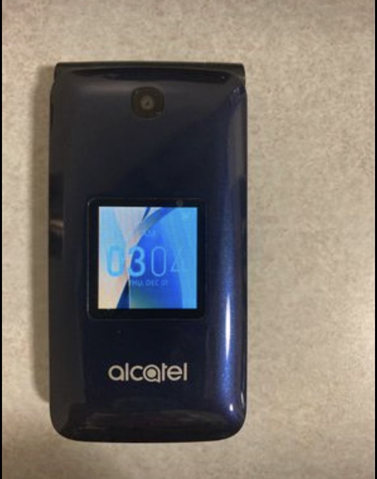 T Mobile Alcatel Flip Phone & Charger.  *** READ BELOW