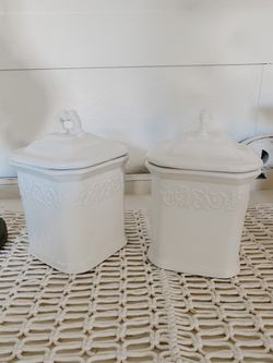 2 White ceramic canisters