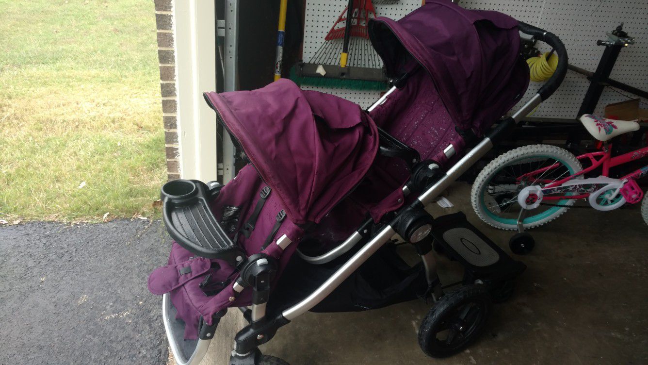 Purple Baby Jogger City Select Stroller with two seats and riding board