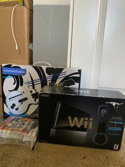 Wii with guitar and guitar hero games
