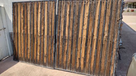 Black metal door gate wood panel.  115 " inches wide X.  70" inches tall .    $. .290. .