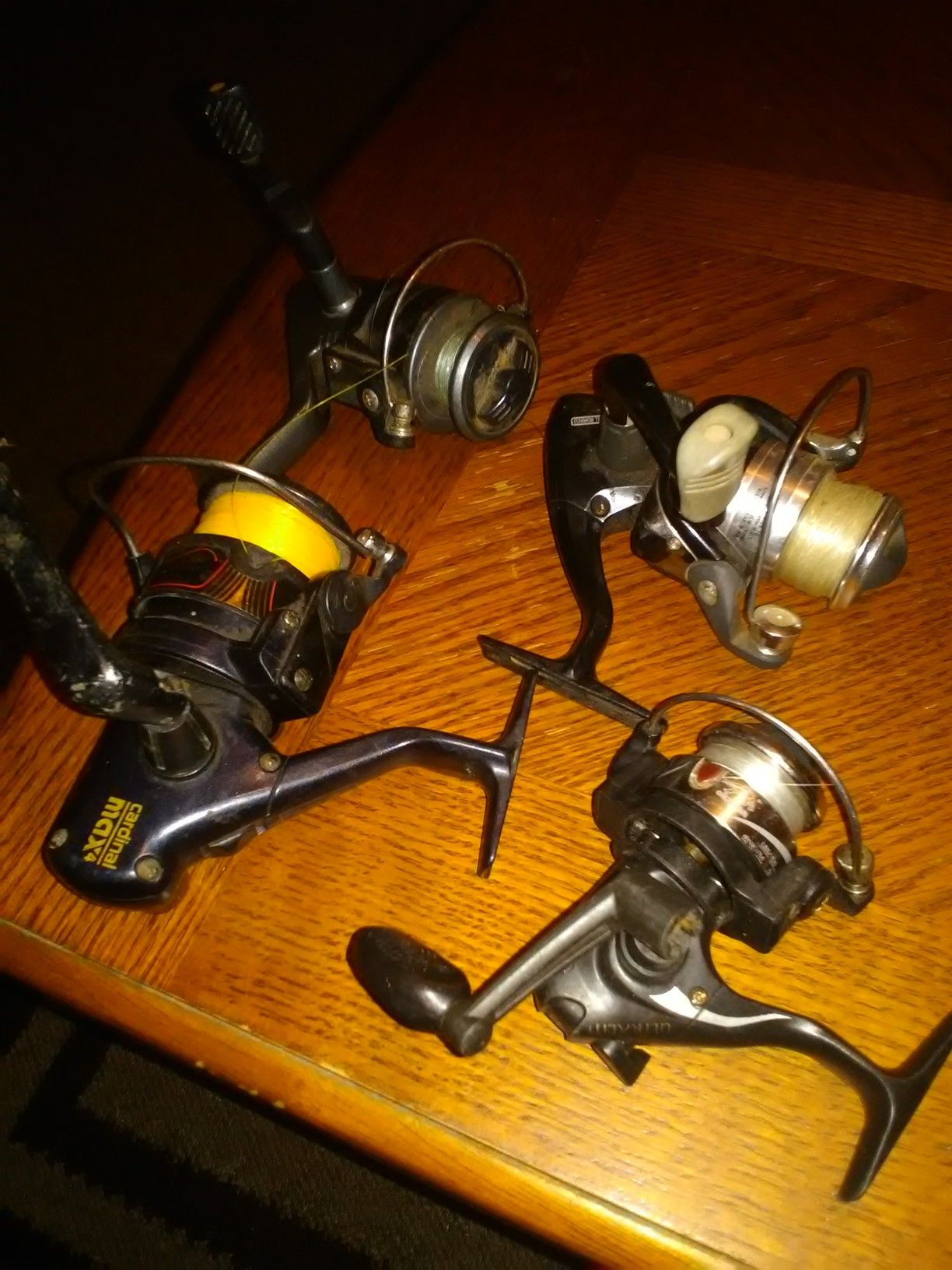 Lot of 4 fishing reels all for 15.00