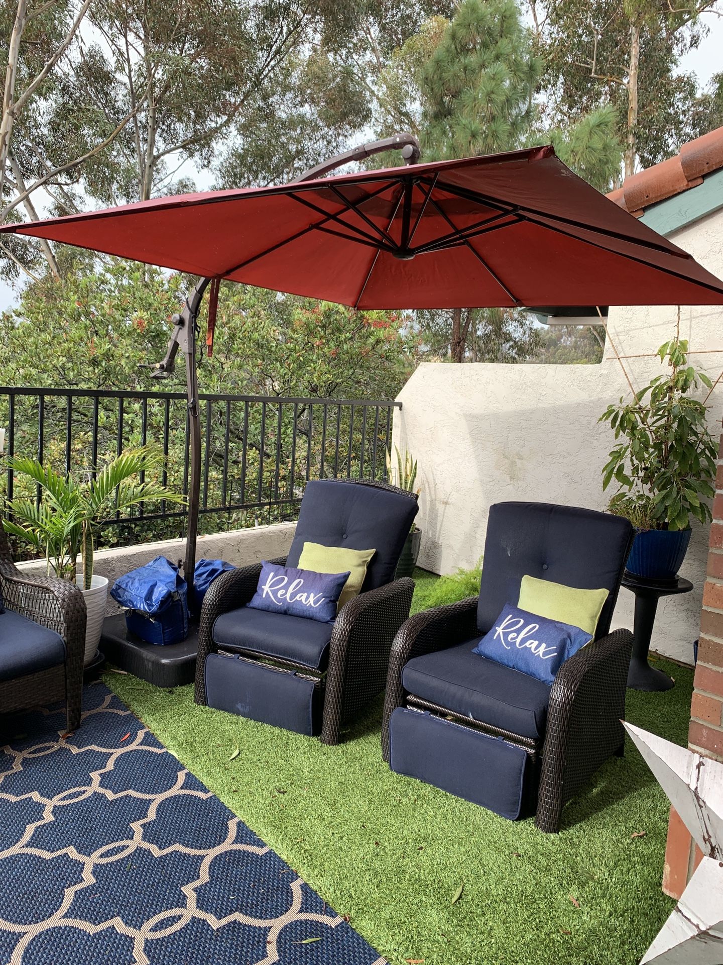black patio set with a red umbrella Midnight Riviera Collection and weatherproof base set Nuu Garden 7 pc. Outdoor