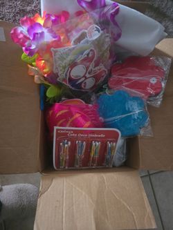 Box of Hawaiian luau decorations