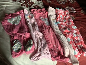 Size 6 months .All 5 caters pajamas and 1- onesie