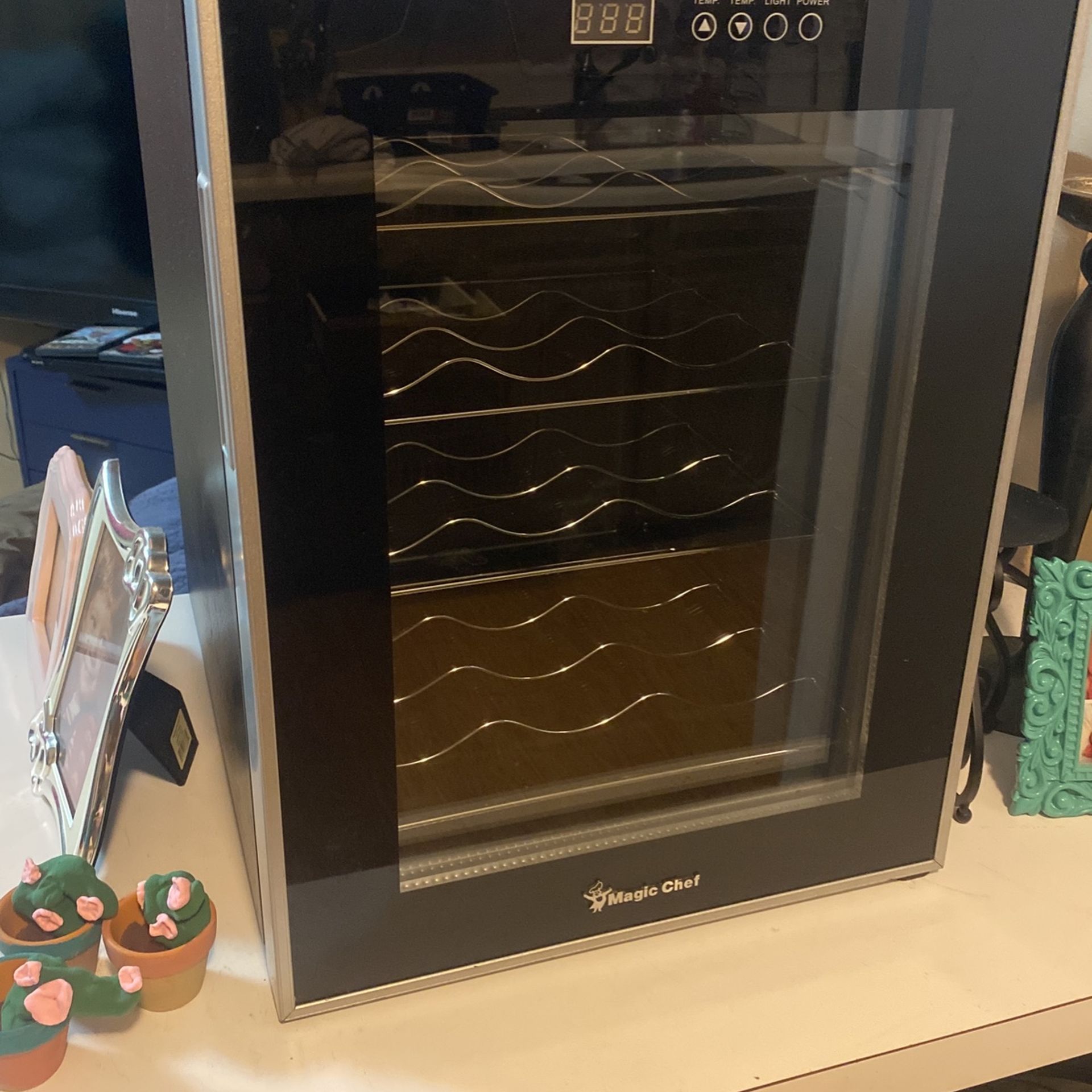 Wine cooler refrigerator holds 12 bottles of wine